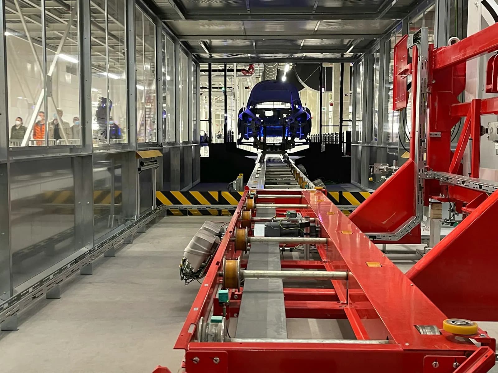 Vehicle moving through a modern automotive manufacturing facility